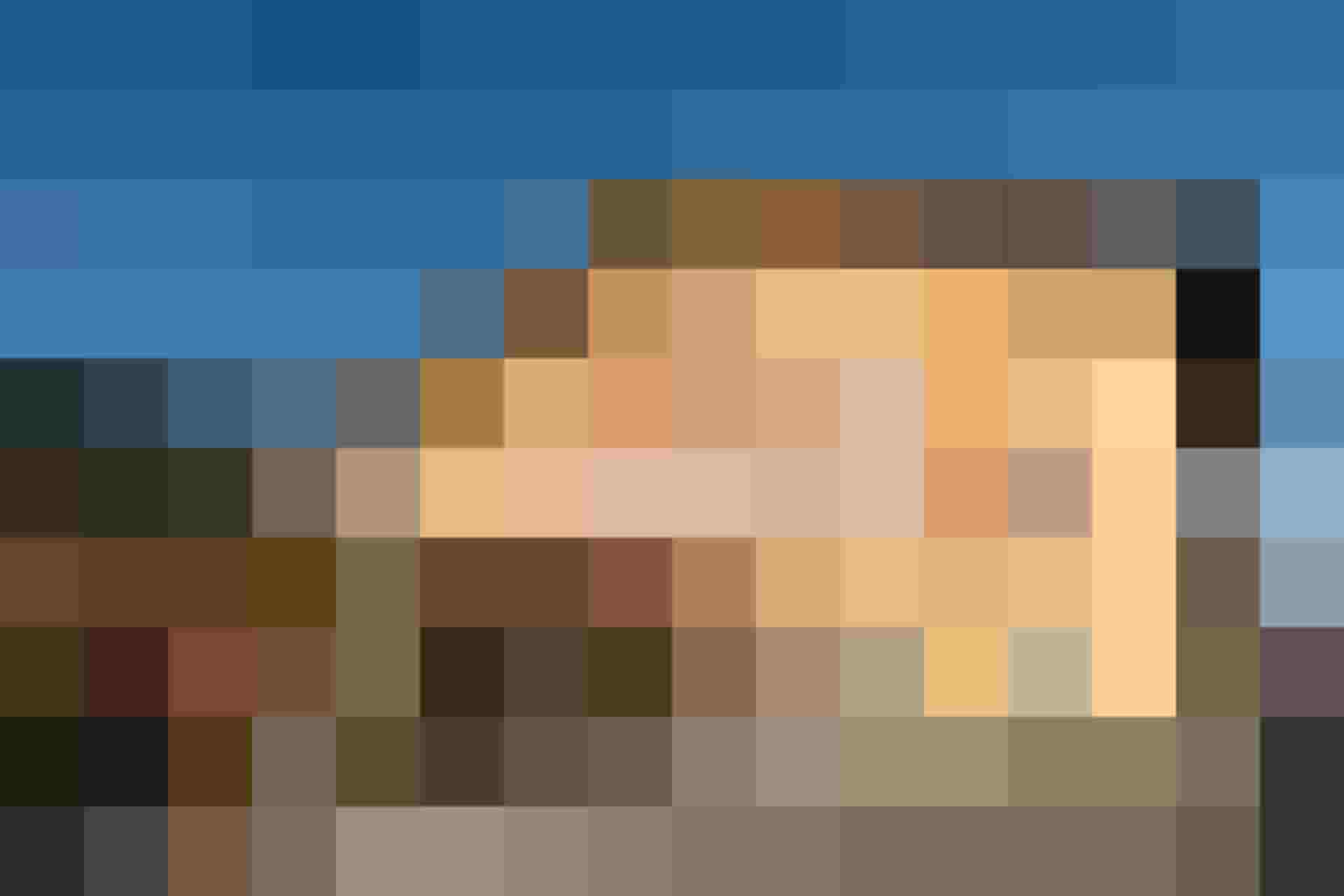 Yellow Traditional Hotel with Red Lettering and Sun Terrace in Salzburger Land